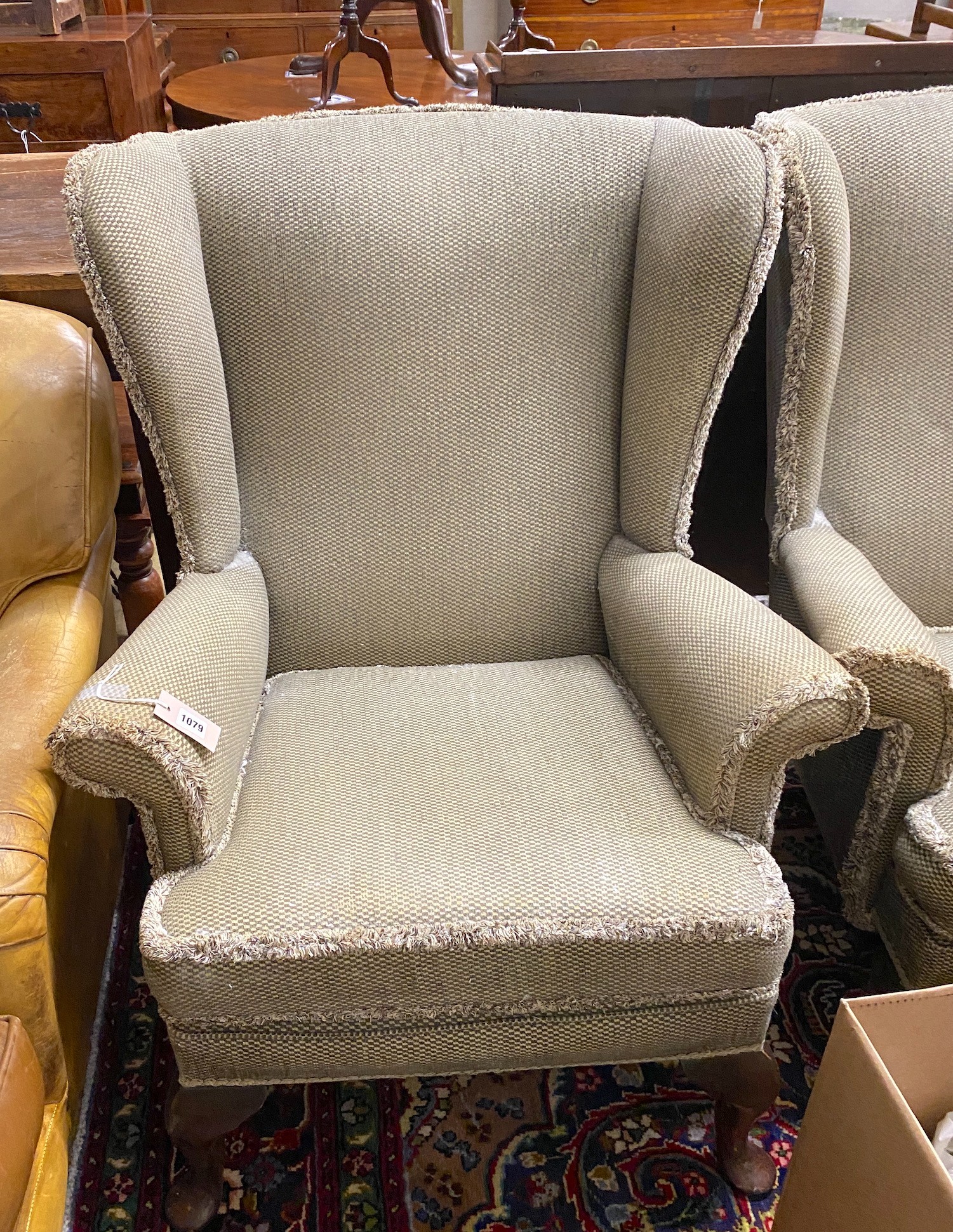 A pair of modern upholstered wing armchairs, width 75cm, depth 70cm, height 96cm